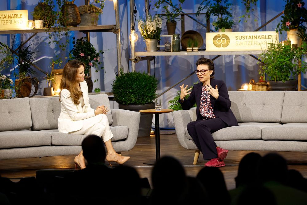 Christine Antlanger-Winter, Country Director of Google Switzerland, speaks on a stage next to a moderator.